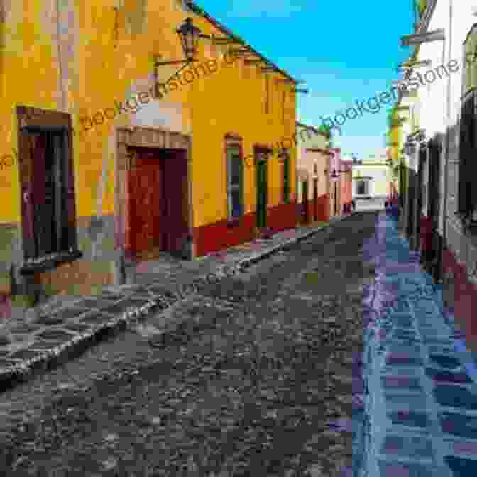 A Cobblestone Street In San Miguel De Allende, Lined With Colorful Colonial Buildings And Balconies. Life In San Miguel: The Real Costs Of Living In San Miguel