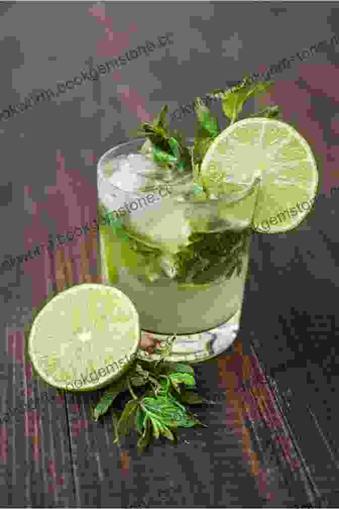 A Refreshing Mojito Cocktail, Garnished With Lime And Mint, Served In A Frosted Glass. Last Dance In Havana: Escape To Cuba With The Perfect Holiday Read