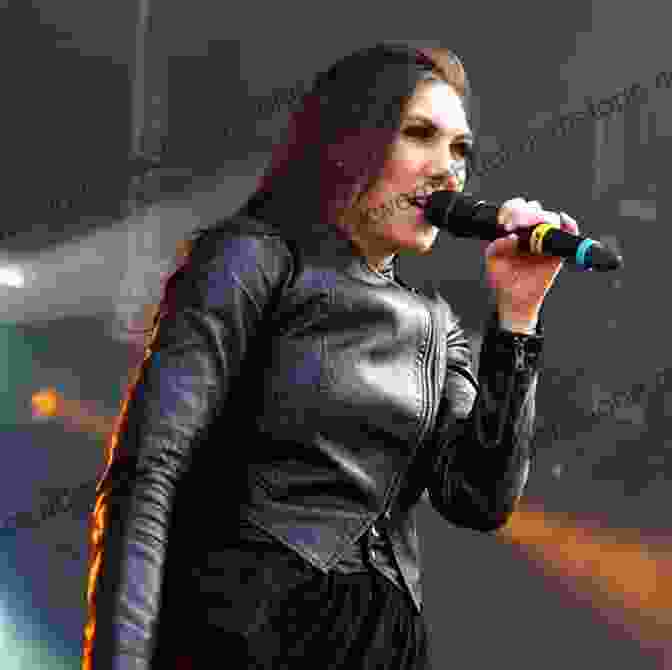 Amaranthe Band Performing Live On Stage, With A Vibrant Light Show Behind Them Abysm: Aurora Renegades Three (Amaranthe 6)